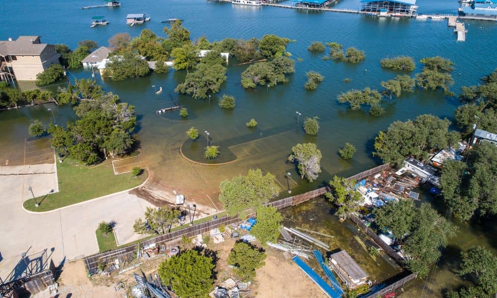 Flooded residential area boundary survey - ALTA SURVEY Florida Aerial view of a flooded residential neighborhood highlighting how a boundary survey can define property limits and prevent drainage problems