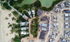 Aerial coastal development near waterfront - ALTA SURVEY Florida Aerial view of coastal development near the shoreline showing how detention pond design must adapt to groundwater, tides, and sandy soil conditions