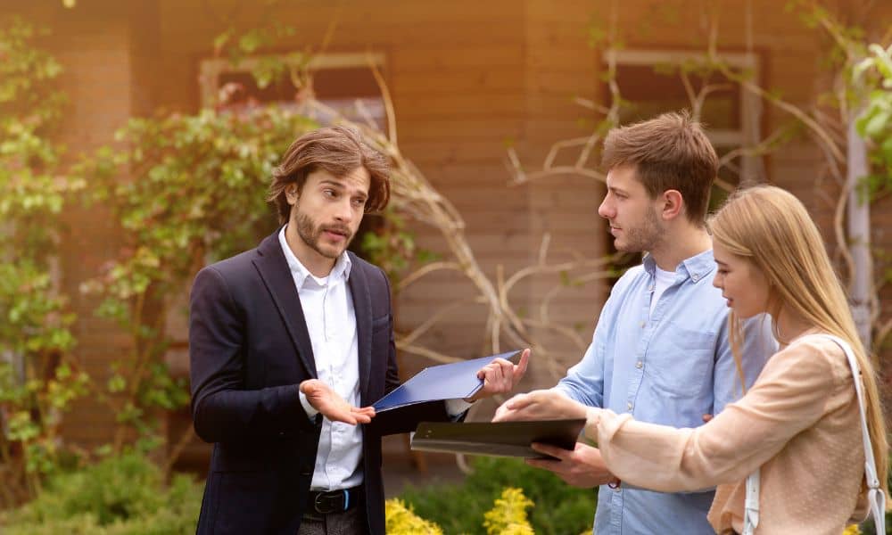 Homeowners reviewing property documents after discovering a boundary survey was needed to clarify ownership