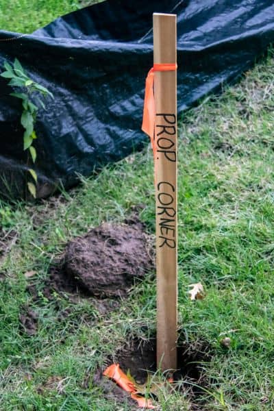 Property corner marker used by a cadastral surveyor to identify legal boundary points