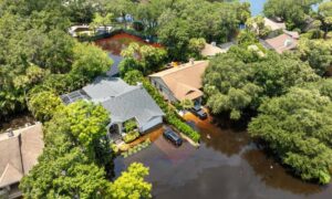 Residential flooding neighborhood - ALTA SURVEY Florida Aerial view of homes showing uneven flooding, highlighting how a topographic survey helps reveal elevation differences before building