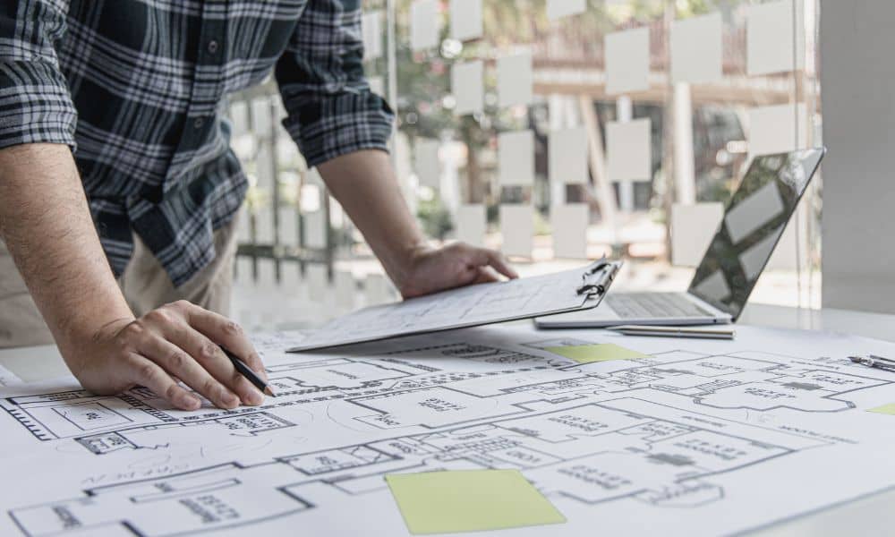 Person reviewing a commercial property site plan during an ALTA survey